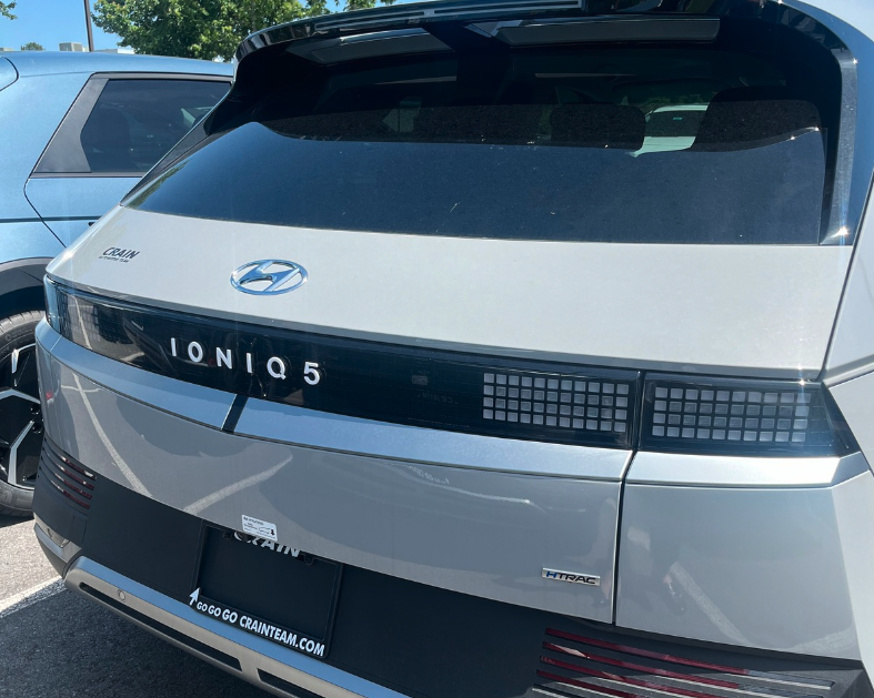 Rear view of a silver Hyundai IONIQ 5 parked at Crain Hyundai dealership